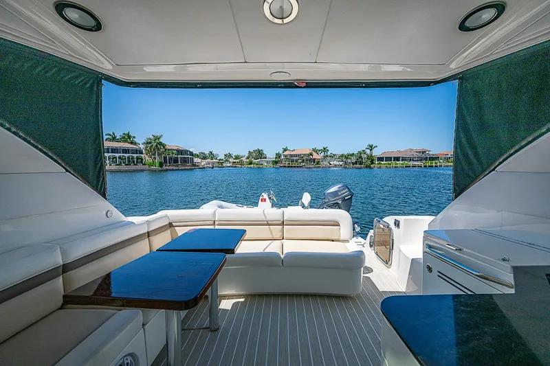 Yacht Photos Pics Luxurious 2014 Sea Ray 470 Sundancer yacht interior with scenic waterfront view.