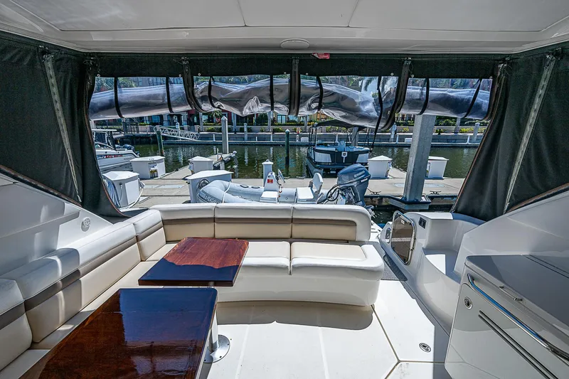  Yacht Photos Pics 2014 Sea Ray 470 Sundancer yacht interior with seating and marina view.