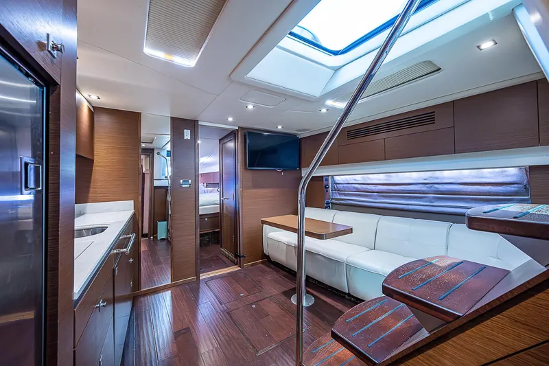  Yacht Photos Pics Luxurious interior of 2014 Sea Ray 470 Sundancer yacht with modern furnishings and skylight.