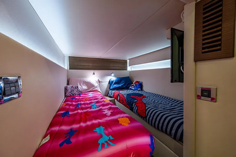  Yacht Photos Pics Cozy twin beds in 2014 Sea Ray 470 Sundancer cabin with colorful bedding.