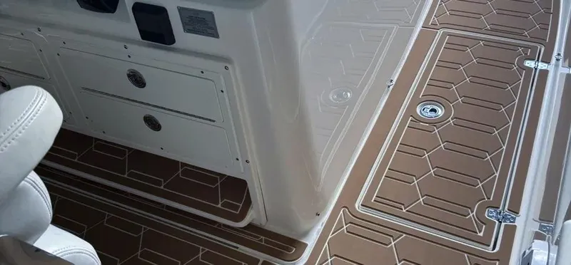  Yacht Photos Pics 2018 Cobia 344 Center Console boat interior with brown and white deck design.