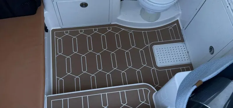  Yacht Photos Pics 2018 Cobia 344 Center Console interior with patterned flooring and seating area.