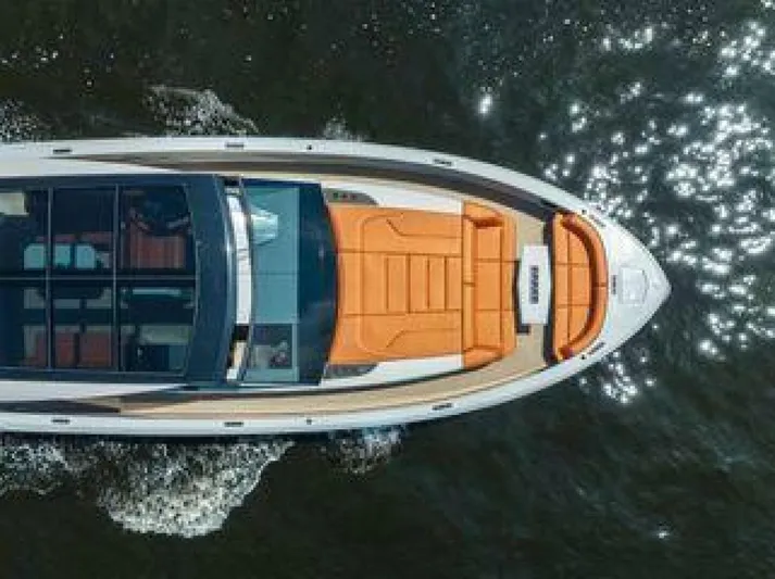 Incentivized Yacht Photos Pics Aerial view of 2021 Vanquish VQ58 luxury yacht cruising on water.