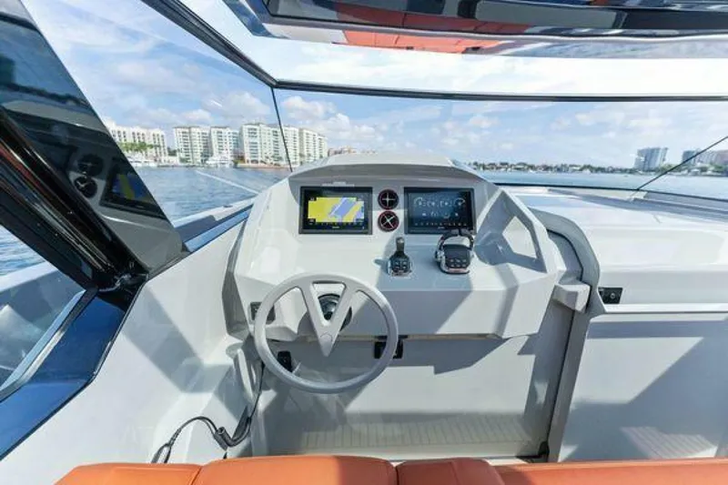 Incentivized Yacht Photos Pics Interior view of 2021 Vanquish VQ58 yacht cockpit with modern navigation system.