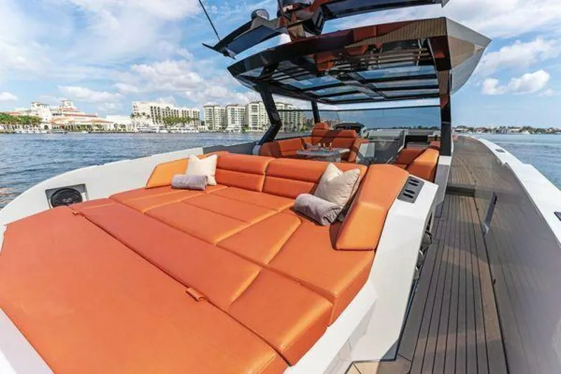 Incentivized Yacht Photos Pics Luxurious 2021 Vanquish VQ58 yacht with spacious orange sunbeds on deck.