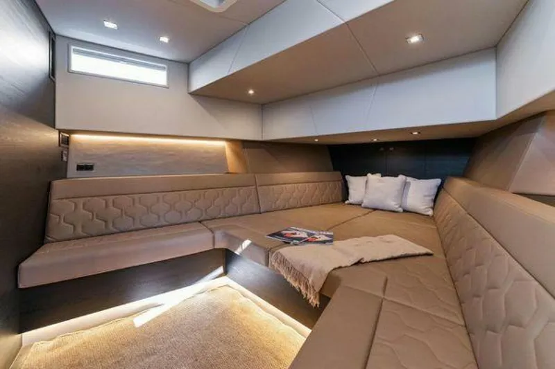 Incentivized Yacht Photos Pics Luxurious interior of 2021 Vanquish VQ58 yacht with elegant seating and ambient lighting.