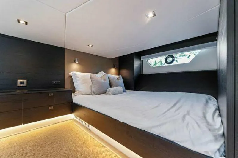 Incentivized Yacht Photos Pics Luxurious bedroom interior of 2021 Vanquish VQ58 yacht with modern design and ambient lighting.