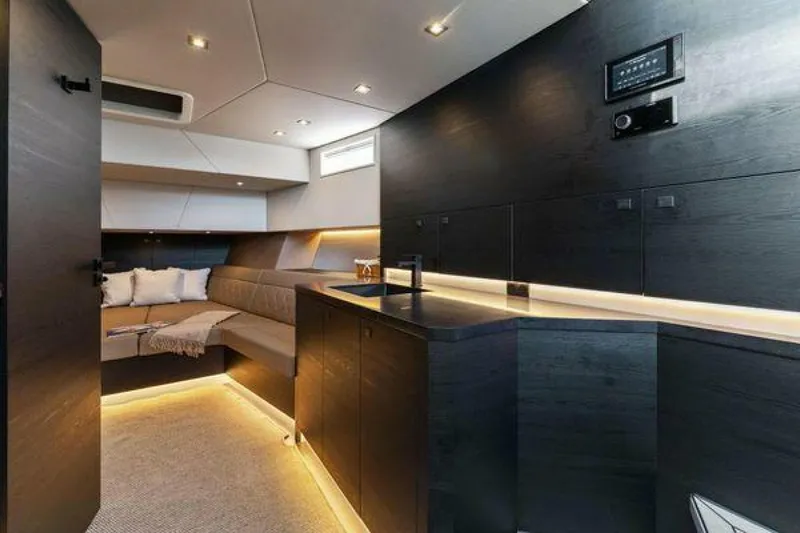 Incentivized Yacht Photos Pics Luxurious interior of 2021 Vanquish VQ58 yacht with modern design and ambient lighting.