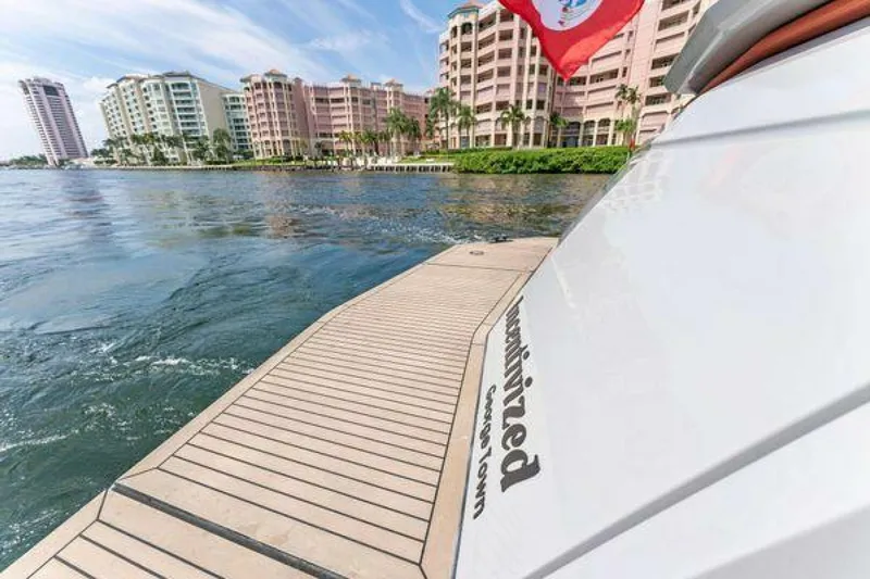 Incentivized Yacht Photos Pics Vanquish VQ58 yacht near waterfront buildings, 2021 model, scenic view.