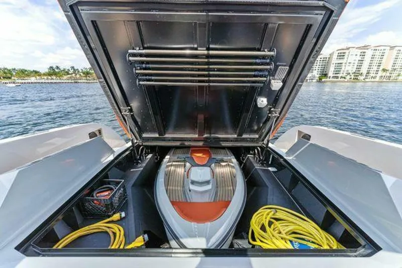 Incentivized Yacht Photos Pics 2021 Vanquish VQ58 yacht storage compartment with watercraft and equipment.