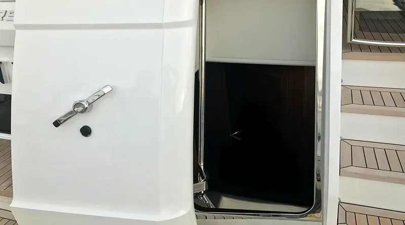  Yacht Photos Pics Entrance to 2017 Princess 68 yacht with open door and wooden deck steps.