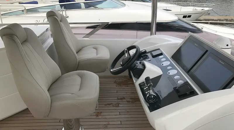  Yacht Photos Pics Luxury yacht helm with dual seats and modern controls, Princess 68, 2017 model.