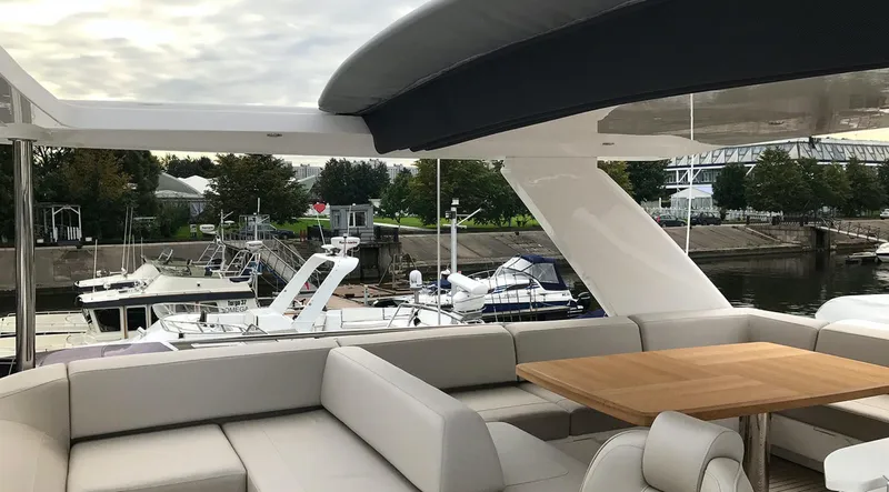 Yacht Photos Pics Luxurious 2017 Princess 68 yacht with spacious outdoor seating and marina view.