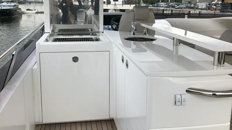  Yacht Photos Pics Luxurious 2017 Princess 68 yacht with sleek outdoor kitchen and seating area.