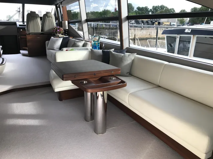  Yacht Photos Pics Luxurious interior of 2017 Princess 68 yacht with elegant seating and table.