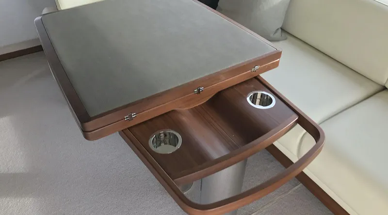  Yacht Photos Pics Luxury yacht interior with wooden table and cup holders, Princess 68, 2017 model.