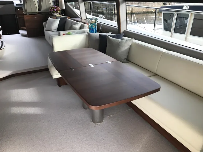  Yacht Photos Pics Luxurious interior of 2017 Princess 68 yacht with elegant seating and table.