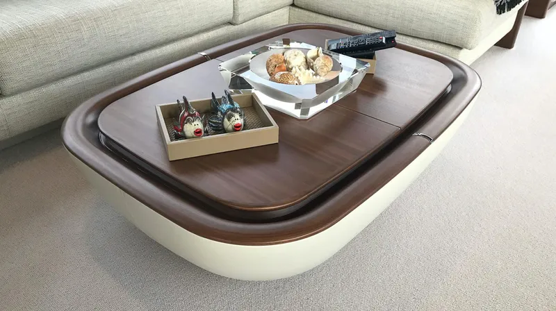  Yacht Photos Pics Luxurious yacht interior with elegant wooden table, snacks, and remote control, Princess 68, 2017 model.