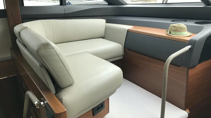  Yacht Photos Pics Luxurious interior of 2017 Princess 68 yacht with beige seating and wooden accents.