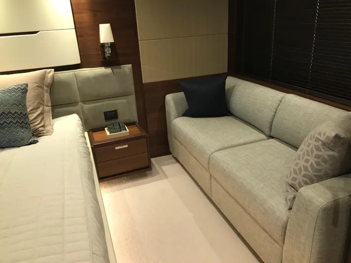  Yacht Photos Pics Luxurious cabin interior of 2017 Princess 68 yacht with bed and sofa.