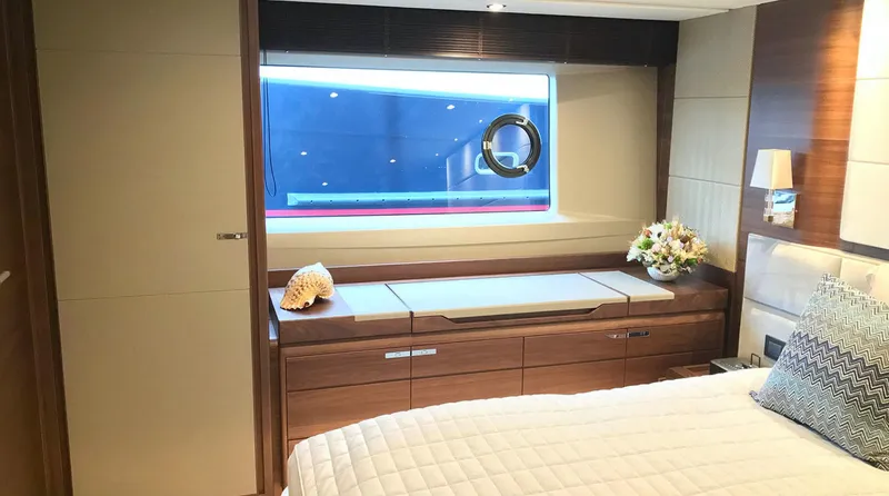  Yacht Photos Pics Luxurious bedroom interior of 2017 Princess 68 yacht with window view.