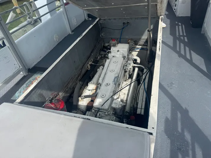 Mega Bite Yacht Photos Pics Engine compartment of 1986 Willard Marine Shark Boat 40', open for maintenance.