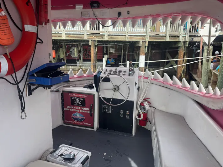 Mega Bite Yacht Photos Pics Interior of a 1986 Willard Marine Shark Boat with shark-themed decor and control panel.