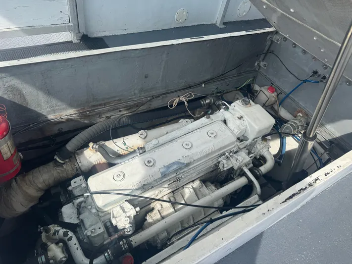 Mega Bite Yacht Photos Pics Engine compartment of a 1986 Willard Marine Shark Boat 40', showing detailed mechanical components.