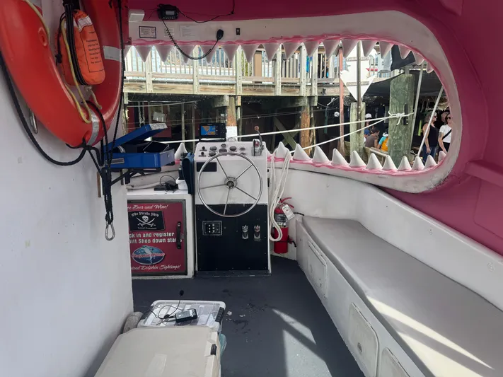 Mega Bite Yacht Photos Pics Interior of 1986 Willard Marine Shark Boat, featuring shark-themed decor and seating for 30 passengers.