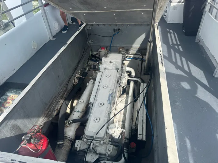 Mega Bite Yacht Photos Pics Engine compartment of a 1986 Willard Marine Shark Boat 40', showing mechanical components.