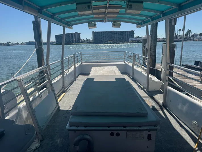 Mega Bite Yacht Photos Pics Interior view of 1986 Willard Marine Shark Boat 40', docked with waterfront background.