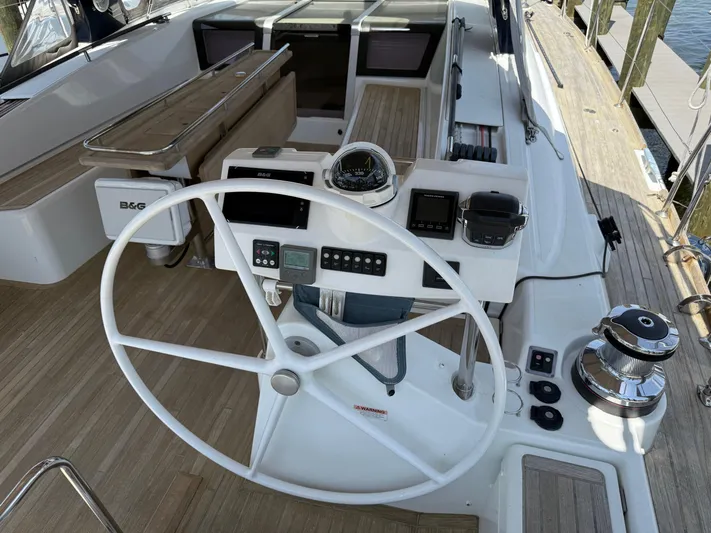 Blue Pearl Yacht Photos Pics Cockpit of 2016 Beneteau Oceanis 60 sailboat with steering wheel and navigation instruments.