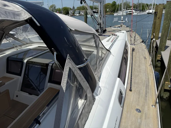 Blue Pearl Yacht Photos Pics 2016 Beneteau Oceanis 60 yacht docked, showcasing sleek deck and cockpit design.