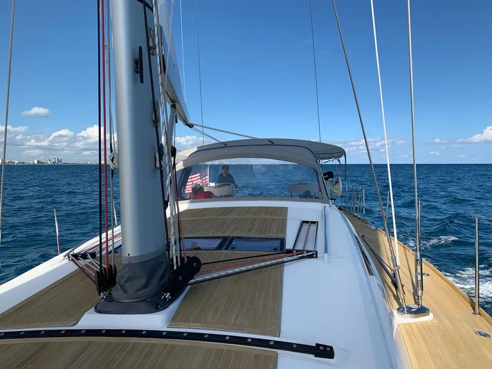 Blue Pearl Yacht Photos Pics Beneteau Oceanis 60 sailing on open sea, 2016 model, clear skies, calm waters.