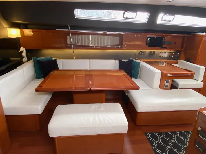Blue Pearl Yacht Photos Pics Luxurious interior of 2016 Beneteau Oceanis 60 yacht with elegant seating and dining area.