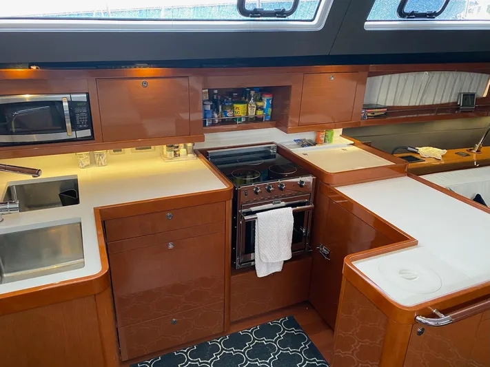 Blue Pearl Yacht Photos Pics Luxurious kitchen interior of 2016 Beneteau Oceanis 60 yacht with modern appliances.