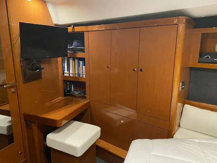 Blue Pearl Yacht Photos Pics Luxurious interior of 2016 Beneteau Oceanis 60 yacht with wood cabinetry and TV.