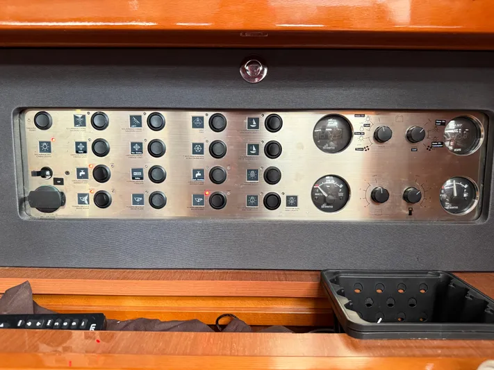 Blue Pearl Yacht Photos Pics Control panel of a 2016 Beneteau Oceanis 60 yacht with various switches and gauges.