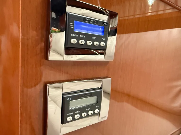 Blue Pearl Yacht Photos Pics Control panels on 2016 Beneteau Oceanis 60 yacht, featuring power and temperature settings.