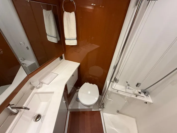 Blue Pearl Yacht Photos Pics Luxurious bathroom in 2016 Beneteau Oceanis 60 yacht with modern fixtures and elegant design.