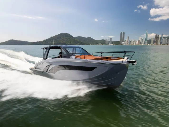  Yacht Photos Pics Luxury Hanover 447 yacht cruising near city skyline, 2025 model.