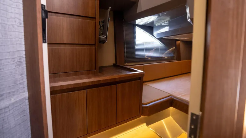  Yacht Photos Pics Luxurious interior of 2025 Hanover 447 yacht with wood paneling and modern design.