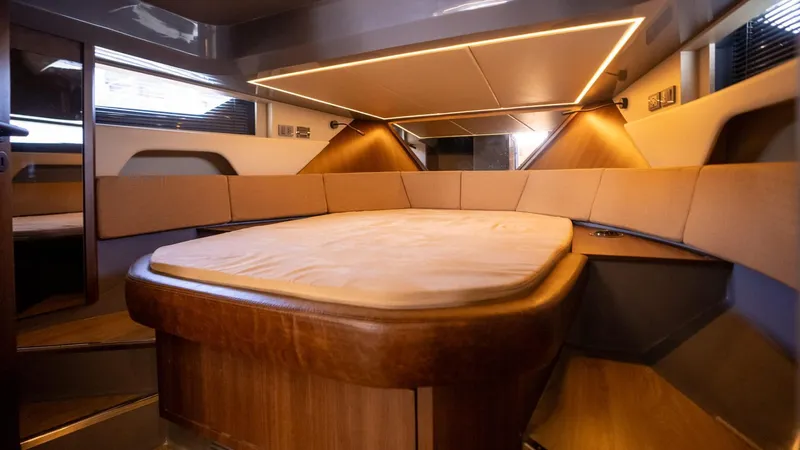 Yacht Photos Pics Luxurious interior cabin of 2025 Hanover 447 yacht with modern lighting and cozy seating.