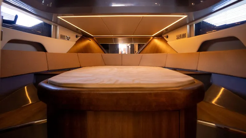  Yacht Photos Pics Luxurious interior of 2025 Hanover 447 yacht with modern lighting and elegant seating.