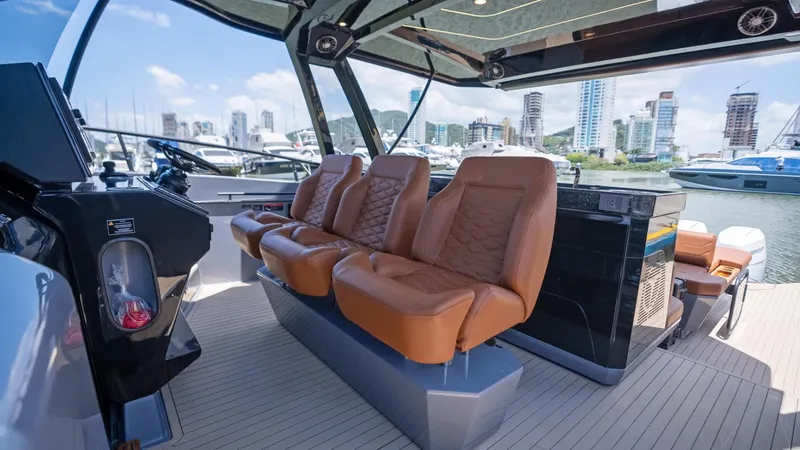  Yacht Photos Pics Luxurious interior of 2025 Hanover 447 yacht with leather seats and marina view.