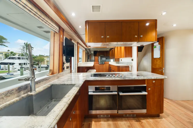 Elysian Yacht Photos Pics Luxurious kitchen interior of 2004 Westport 130 Tri-Deck Motor Yacht with modern appliances.