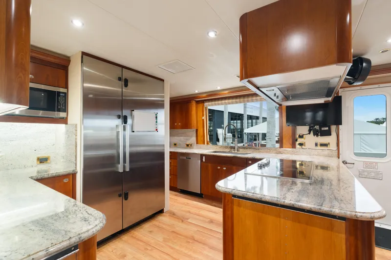 Elysian Yacht Photos Pics Luxurious kitchen interior of 2004 Westport 130 Tri-Deck Motor Yacht with modern appliances.