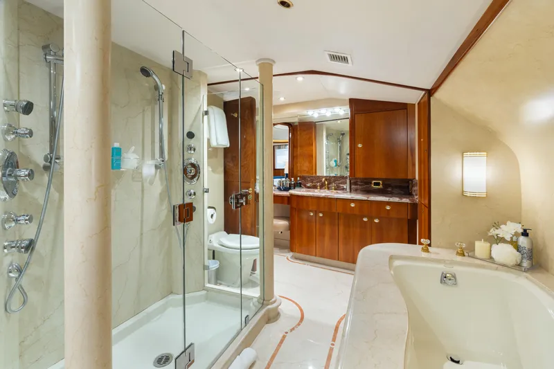 Elysian Yacht Photos Pics Luxurious bathroom on 2004 Westport 130 Tri-Deck Motor Yacht with shower and bathtub.