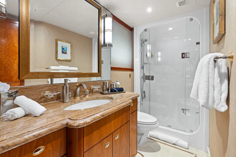 Elysian Yacht Photos Pics Luxurious bathroom on 2004 Westport 130 Tri-Deck Motor Yacht with elegant fixtures and shower.