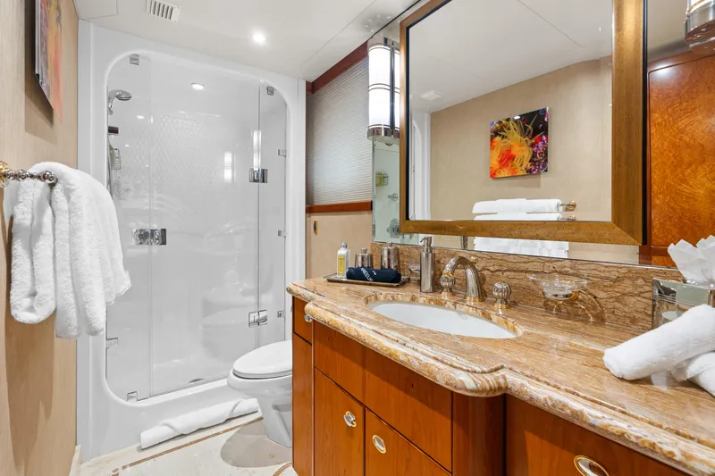 Elysian Yacht Photos Pics Luxurious bathroom in 2004 Westport 130 Tri-Deck Motor Yacht with elegant fixtures and shower.